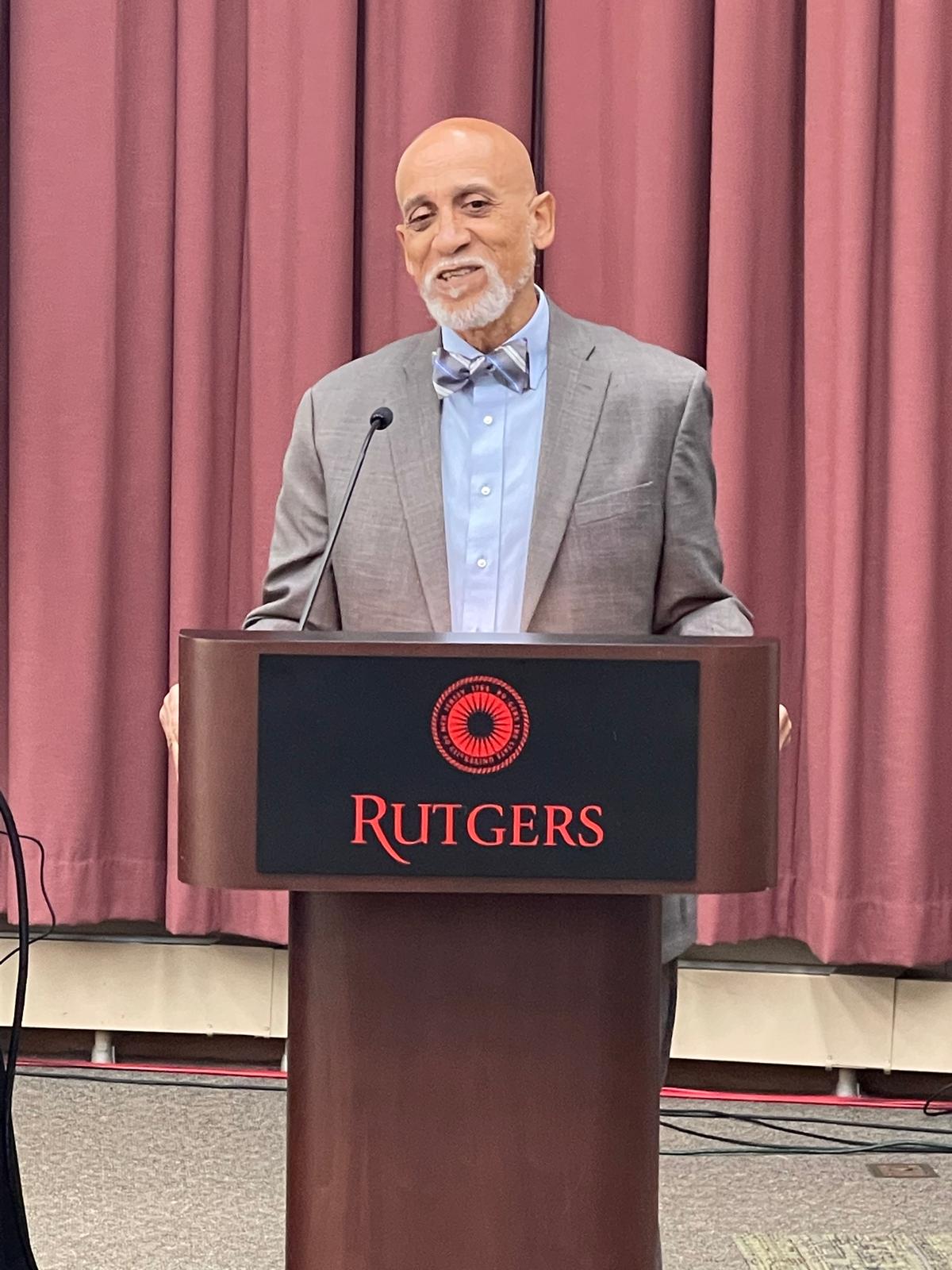 Dr. Frederick Tyson delivering remarks at a Rutgers University lectern