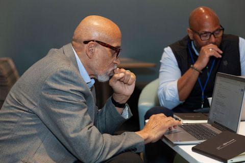 Dr. Frederick Tyson working alongside a collaborator during a working session